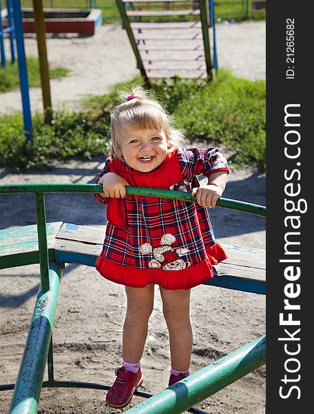 Adorable Little Girl Playing In The Playground