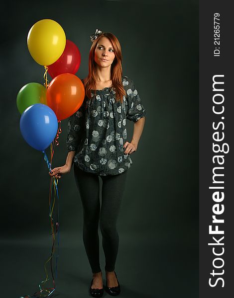 Woman with balloons on grey background. Woman with balloons on grey background