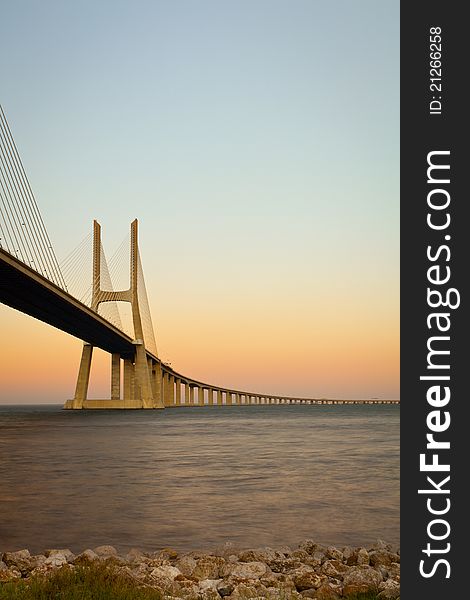 View of Vasco da Gama bridge at sunrise. View of Vasco da Gama bridge at sunrise.