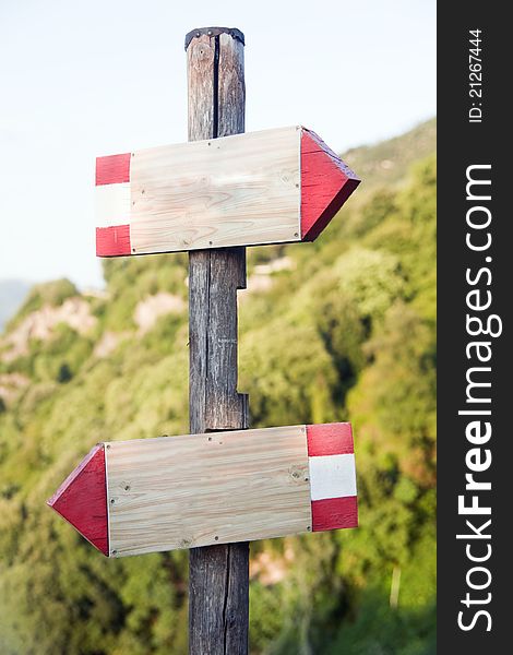 Wooden signs indicators in the mountains on the path of marmore waterfalls