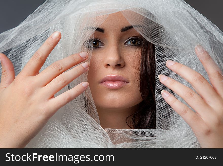 Beautiful Woman s Face Surrounded By Tulle Fabric