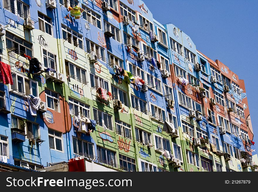 Air-condition devices fitted on the exterior of the building in Qingdao in China. Air-condition devices fitted on the exterior of the building in Qingdao in China