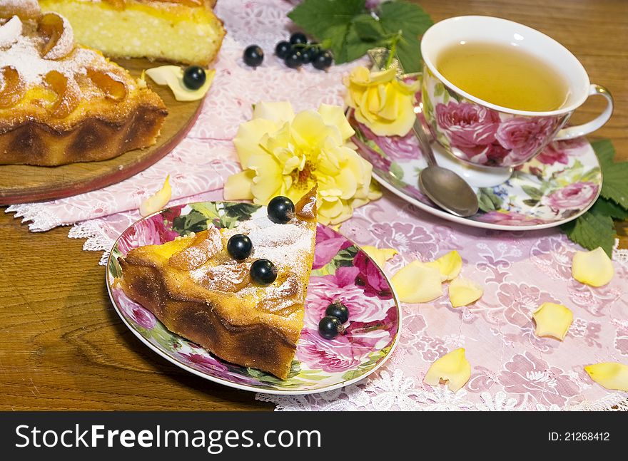 Cheese cake with apricots and a cup of green tea. Summer day. Cheese cake with apricots and a cup of green tea. Summer day