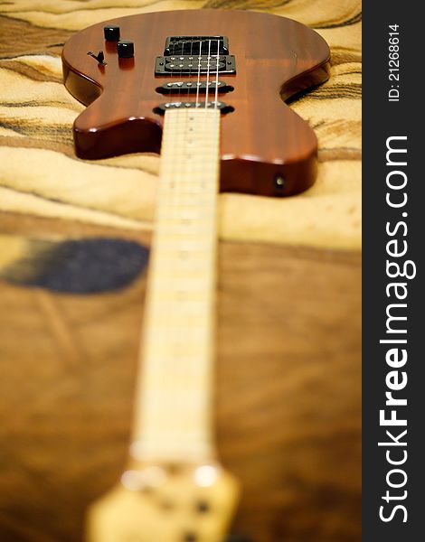 Brown electric guitar close up