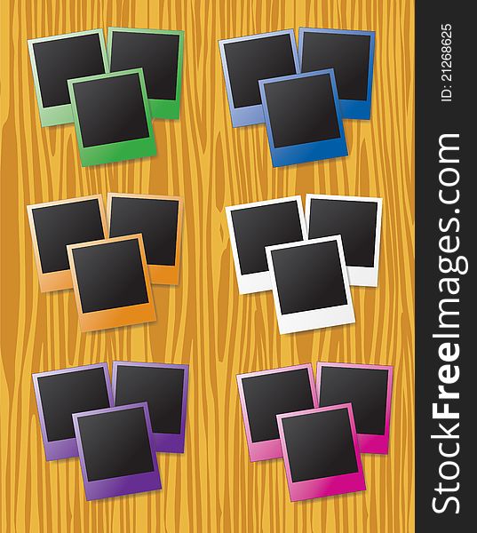 Groups of instant photos in different colors on wood background. Groups of instant photos in different colors on wood background
