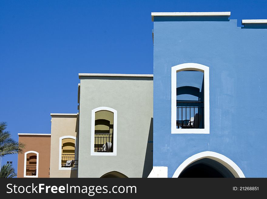 Nice blue hotel in Egypt with clear sky. Summer va