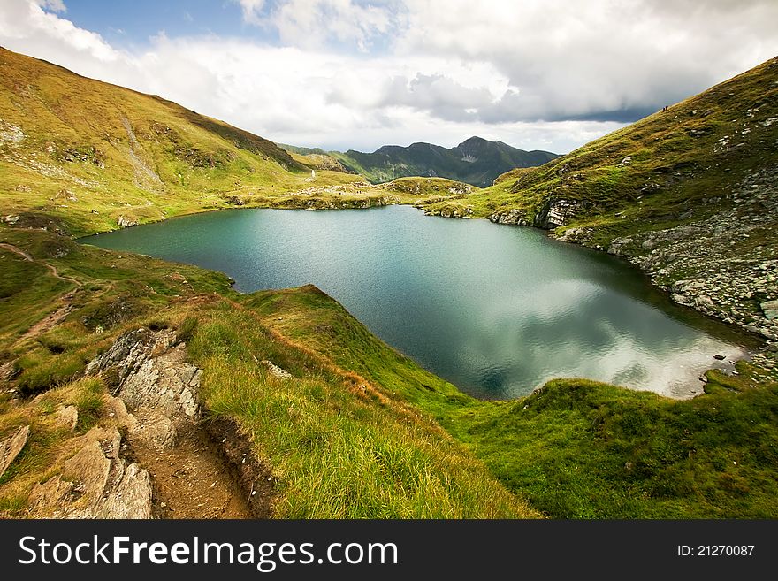 Landscape from Capra Lake in Romania and Fagaras mountains in the summer