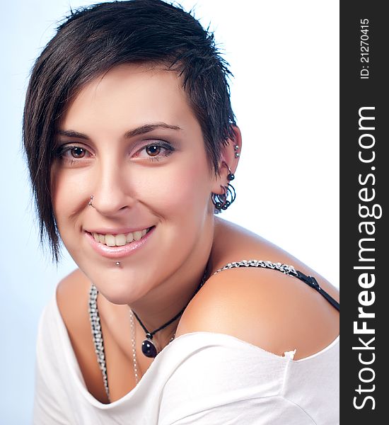 Happy brunette teenager girl with rock attitude on white background. Happy brunette teenager girl with rock attitude on white background