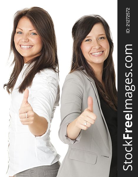 Portrait of two businesswomen showing thumbs up. Isolated on white