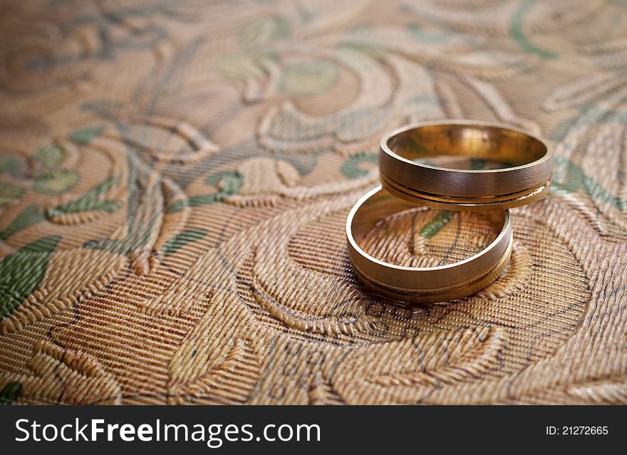 Wedding rings on abstract background