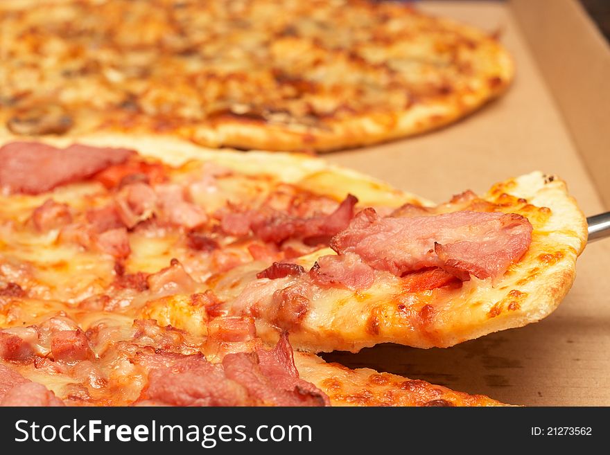 Tasty italian thin crust pizza with bacon and mozzarella cheese. Tasty italian thin crust pizza with bacon and mozzarella cheese