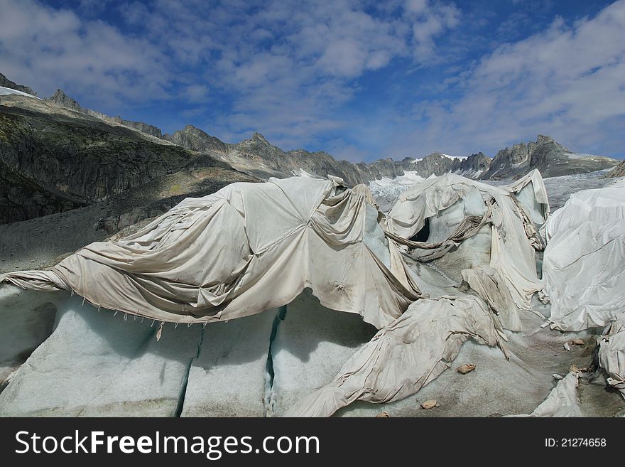Part of the ice cave in Rhone glacier in the Swiss alps is covered with fleece in try to prevent melting occurring due to global warming.