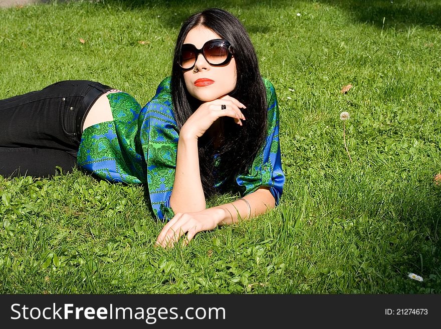 Girl lying on grass in park