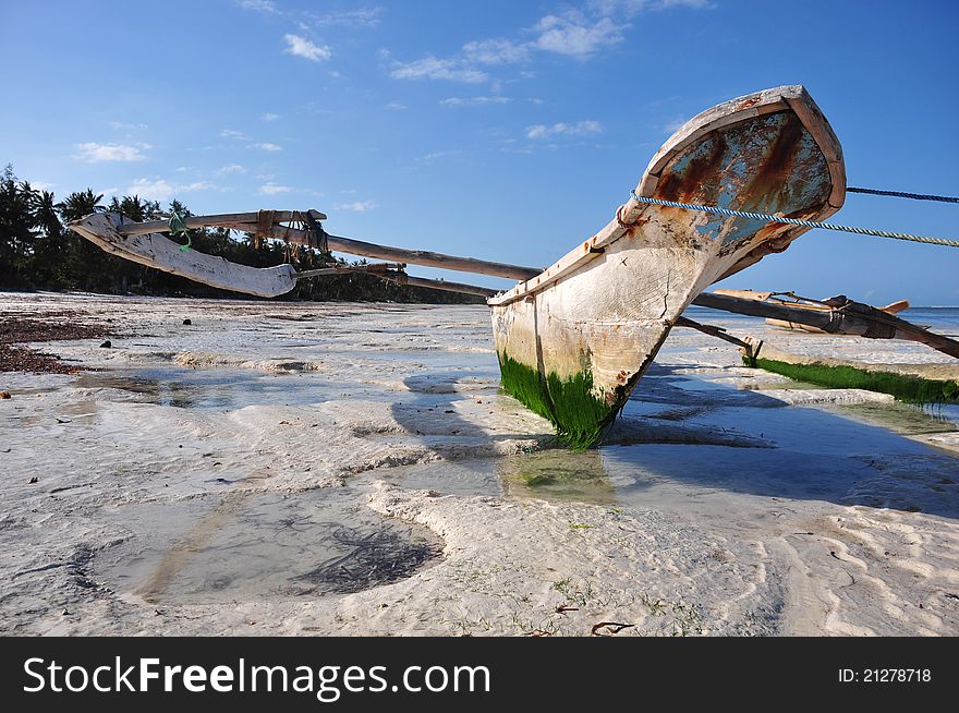 Boats on the beach of zanzibar during a low tide. Boats on the beach of zanzibar during a low tide