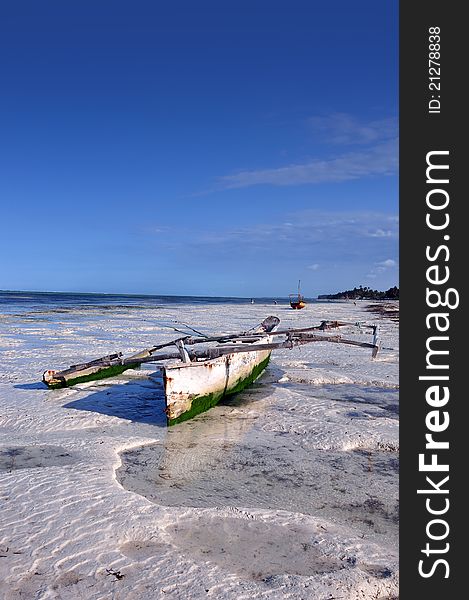 Boats on the beach of zanzibar during a low tide. Boats on the beach of zanzibar during a low tide