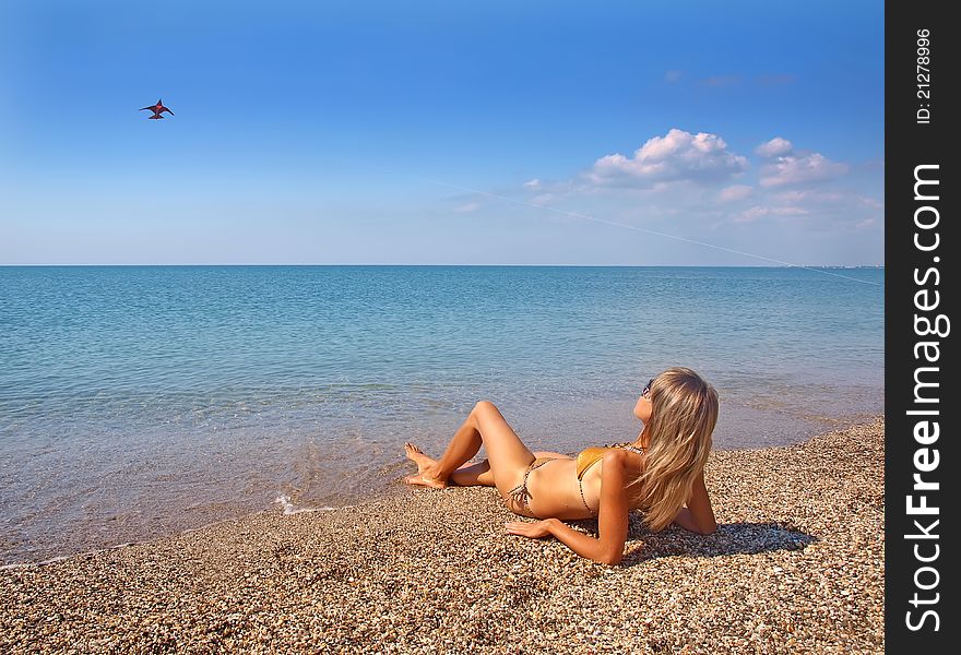 Beautiful girl relaxing on a summer beach