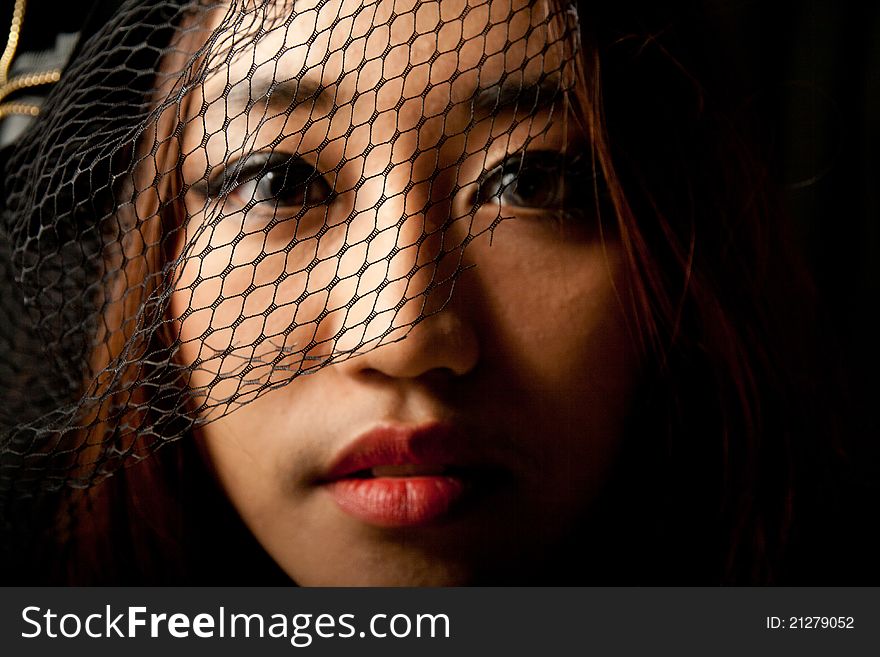 Portrait Of Asian Girl In Low Key
