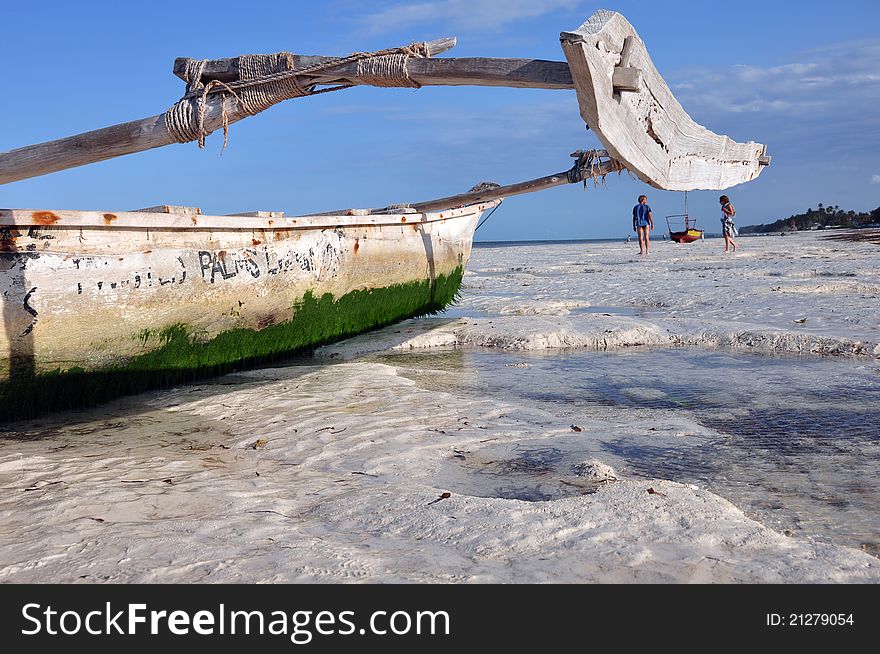 Boats on the beach of zanzibar during a low tide. Boats on the beach of zanzibar during a low tide