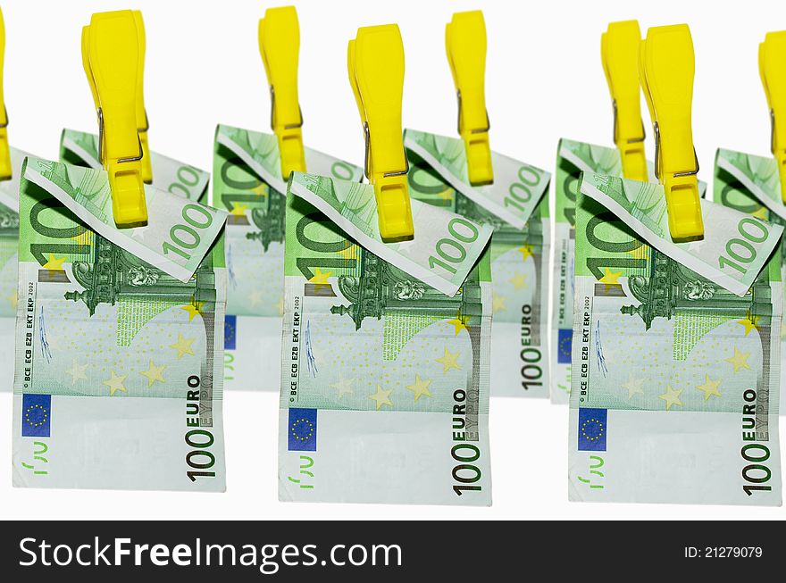 Euro banknotes hanging on clothespins on white background. Euro banknotes hanging on clothespins on white background