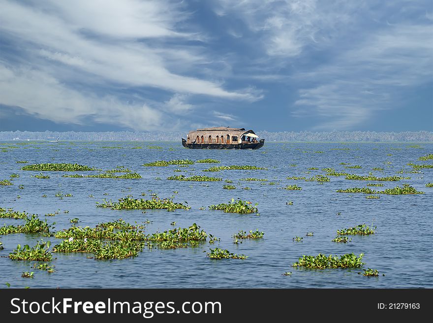 House boat in the Kerala (India) Backwaters. Used to carry rice in the olden days. Now primarily used as houseboats.