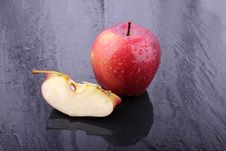 Red Apple On Wet Floor Royalty Free Stock Photo