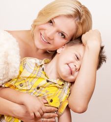 Happy Mother With Her Child Together On A White Stock Photo