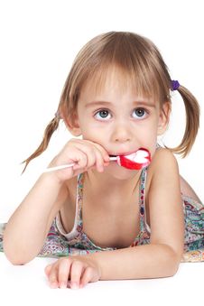Little Girl Biting Red Heart-shaped Lollipop Stock Photography Little Girl Biting Red Heart-shaped Lollipop Stock Photography