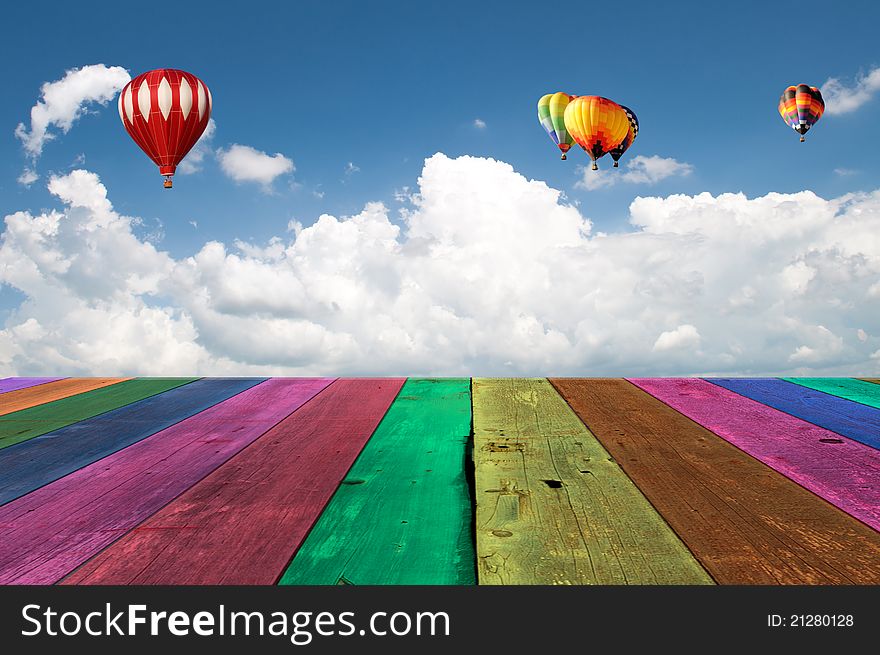 Multi Color wooden wooden view of a cloudy blue sky