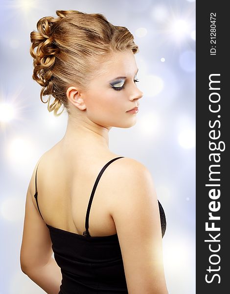 Girl with beautiful hairstyle on a light background