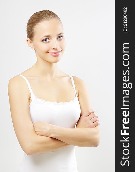 Portrait of a beautiful girl on a gray background