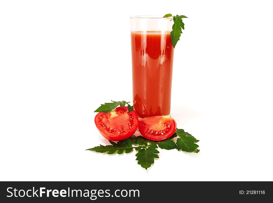 Glass of tomato juice with slices of tomato on white background