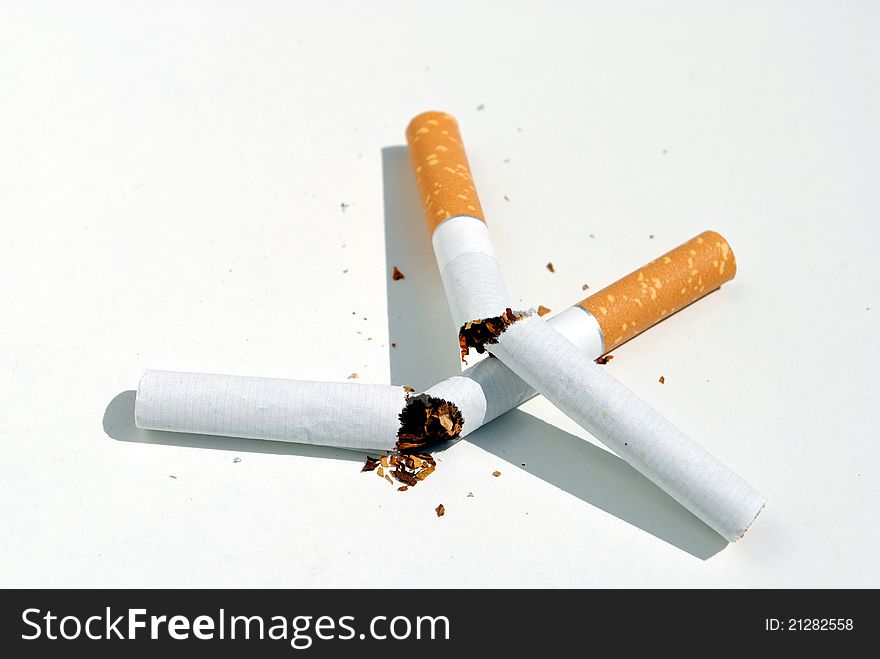 Two cigarettes broken, concept of quit smoking