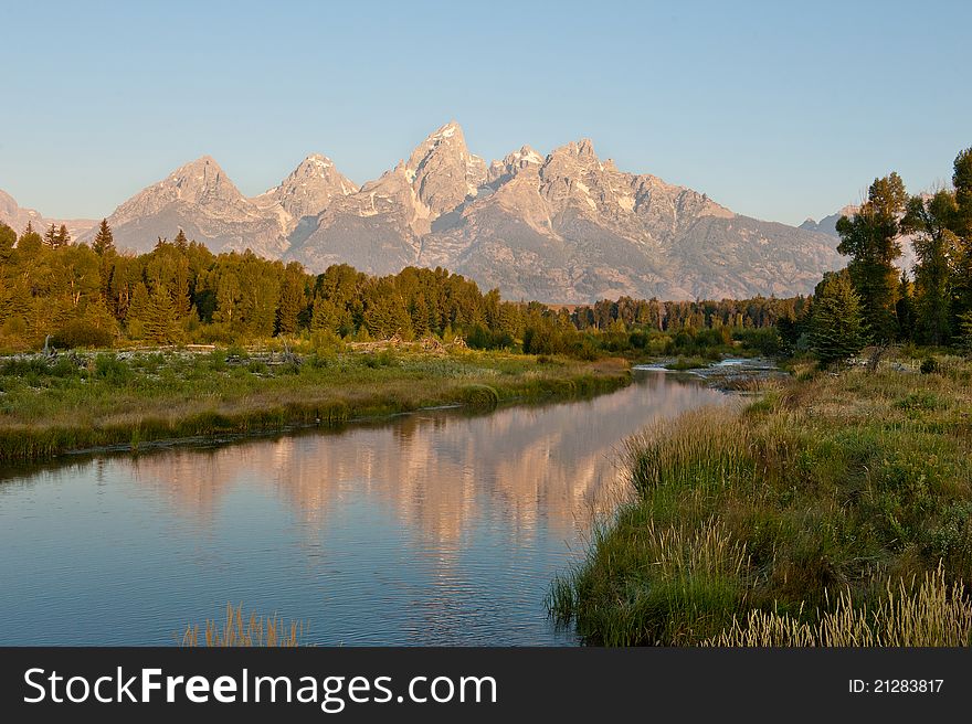 A reflection of the Grand Tetons in a stream. A reflection of the Grand Tetons in a stream