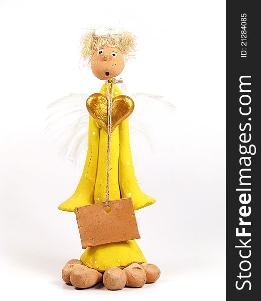 Funny angel toy with big golden heart and blank plate on the twine