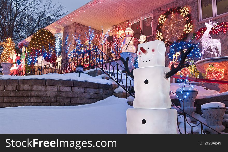 Urban home decorated for Christmas with lively cartoon characters, snowmen, animals and lights. Urban home decorated for Christmas with lively cartoon characters, snowmen, animals and lights.