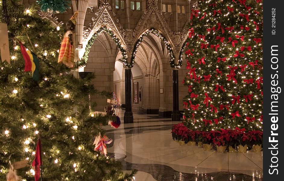 The Canadian Parliament Rotunda decorated for Christmas with two beautiful trees. The Canadian Parliament Rotunda decorated for Christmas with two beautiful trees.