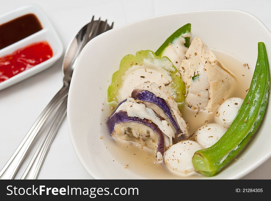 Traditional Oriental vegetable soup topped with spices.