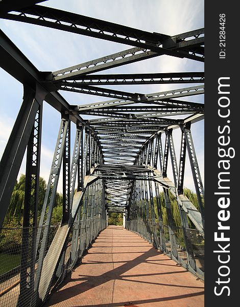 A steel structure bridge with blue sky.