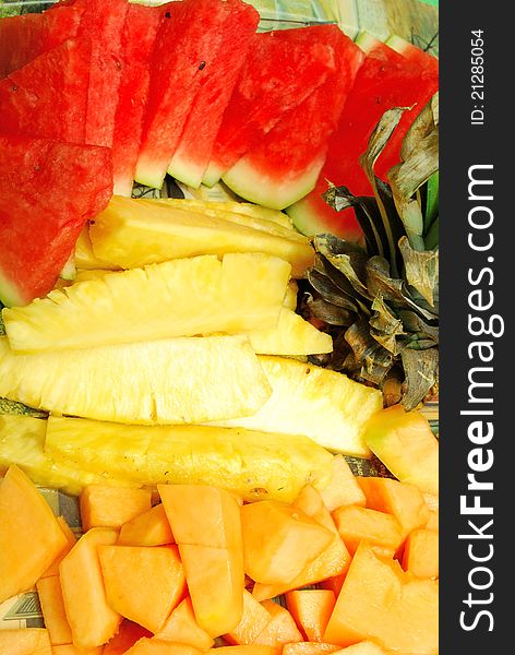 Closeup of Fruit Plate with watermelon, melon, pineapple on Hawaii party.