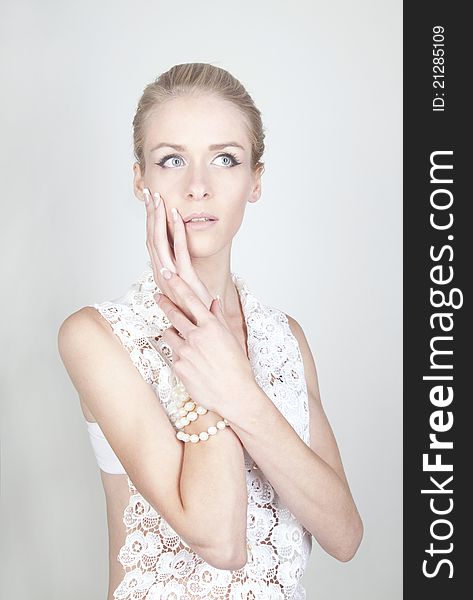 Portrait of young beautiful blond woman with long acrylic nails
