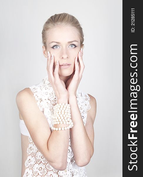 Portrait of young beautiful blond woman with long acrylic nails