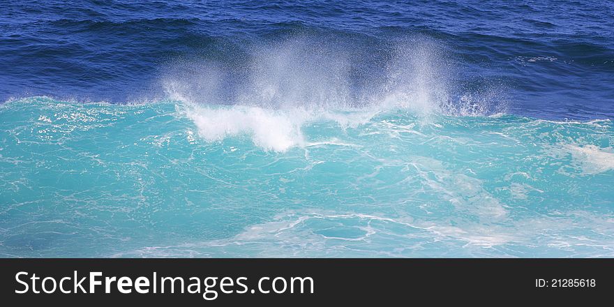 A wave in the moment of mounting - in its natural aqua colors. A wave in the moment of mounting - in its natural aqua colors