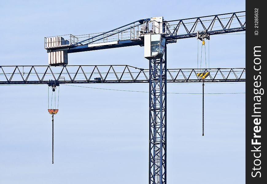 Two tower cranes against the sky. Two tower cranes against the sky