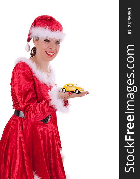 The young Santa Claus is holding a car in her hand. The young Santa Claus is holding a car in her hand