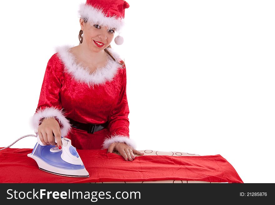 Young Santa Claus is ironing a suit. Young Santa Claus is ironing a suit