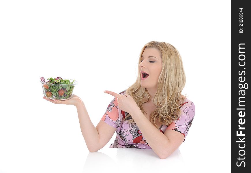 Casual woman eating healthy green vegetable salad. isolated on white