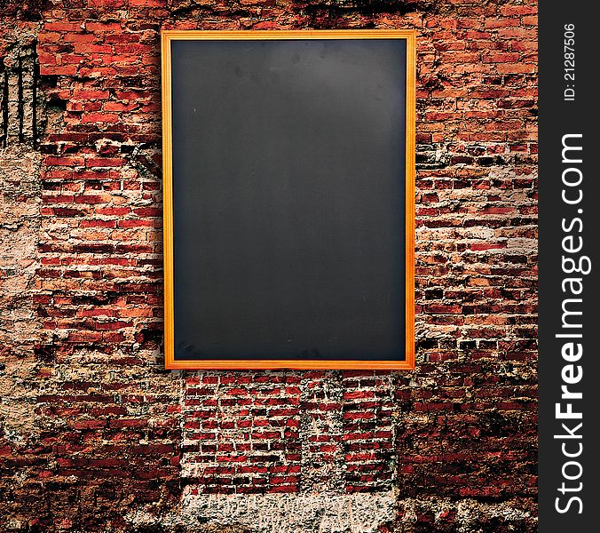 Blank Blackboard on Old brick wall for background. Blank Blackboard on Old brick wall for background