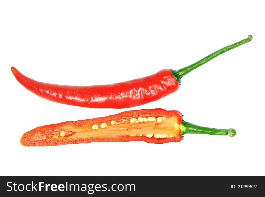 Sectional View Of A Cut Fresh Chili. Image Is Isolated On White Background. Sectional View Of A Cut Fresh Chili. Image Is Isolated On White Background