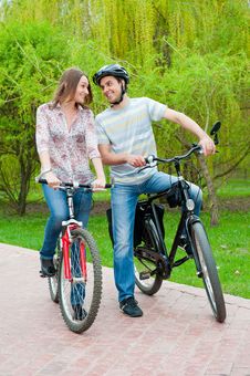 Happy Young Couple Riding Bicycles Stock Photo Happy Young Couple Riding Bicycles Stock Photo