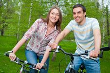 Happy Young Couple Riding Bicycles Stock Image Happy Young Couple Riding Bicycles Stock Image